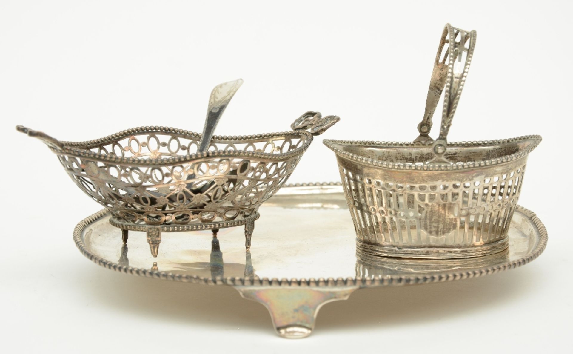 A Dutch 18thC salver, Amsterdam hallmark (restored), a little silver basket, probably Austro-