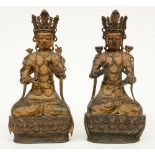 A pair of Chinese gilt and polychrome decorated bronze Buddhas, 18thC, H 36 cm (minor damage and