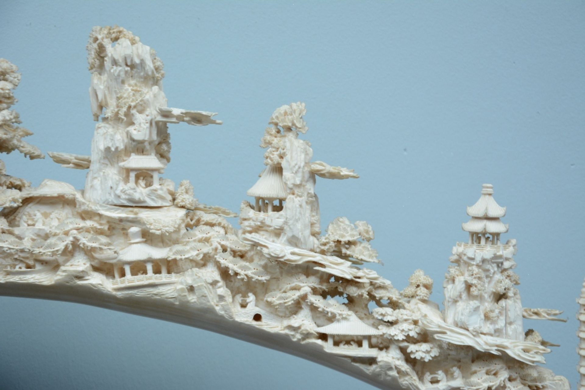 An exceptional Chinese richly carved ivory tusk, depicting various temples and pagodes in a - Image 4 of 7