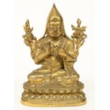 An Oriental bronze sculpture depicting a Buddhist Lama, H 18 cm