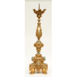 A gilt and silver wooden candlestick, 19thC, H 103,5 cm