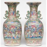 A large pair of Chinese famille rose vases decorated with court scenes, 19thC, H 85,5 - 86 cm (one