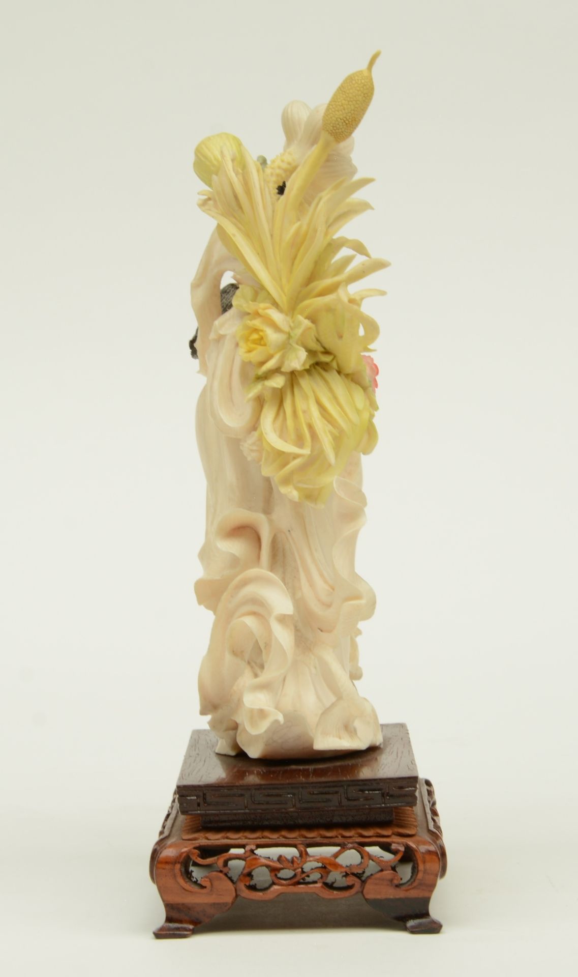 A Chinese ivory sculpture, polychrome decorated, depicting a court lady holding a flower basket, - Image 4 of 6