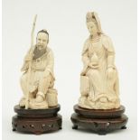 A Chinese ivory Guanyin seated on a rock, late Qing-dynasty, on a damascened hardwood plinth;