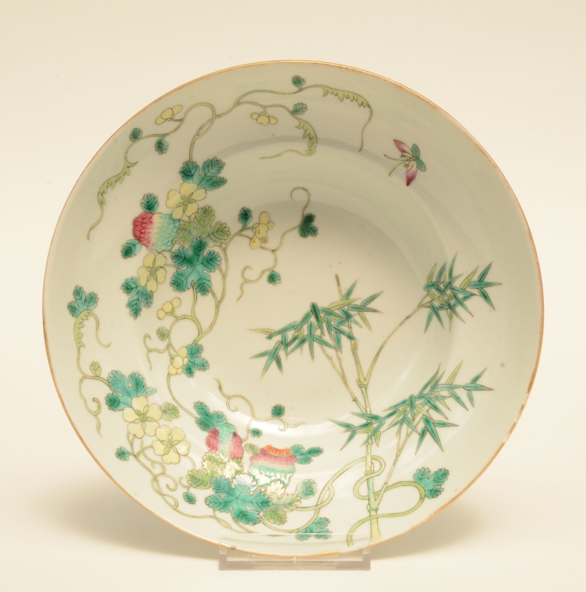 A Chinese polychrome decorated bowl painted on both inner side and outer side with a bamboo branch