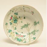 A Chinese polychrome decorated bowl painted on both inner side and outer side with a bamboo branch