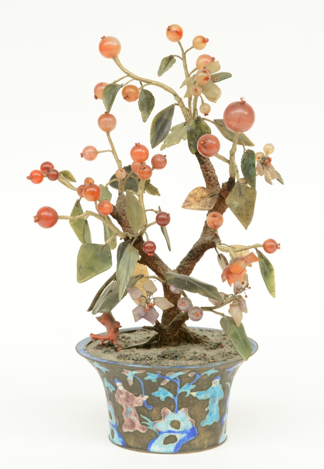 A Chinese ornamental tree with semi-precious stones in a brass enamel decorated jardiniere, H 36 cm