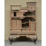 A Japanese wooden display cabinet, carved with birds, flowerbranches and a landscape, ca. 1900, H