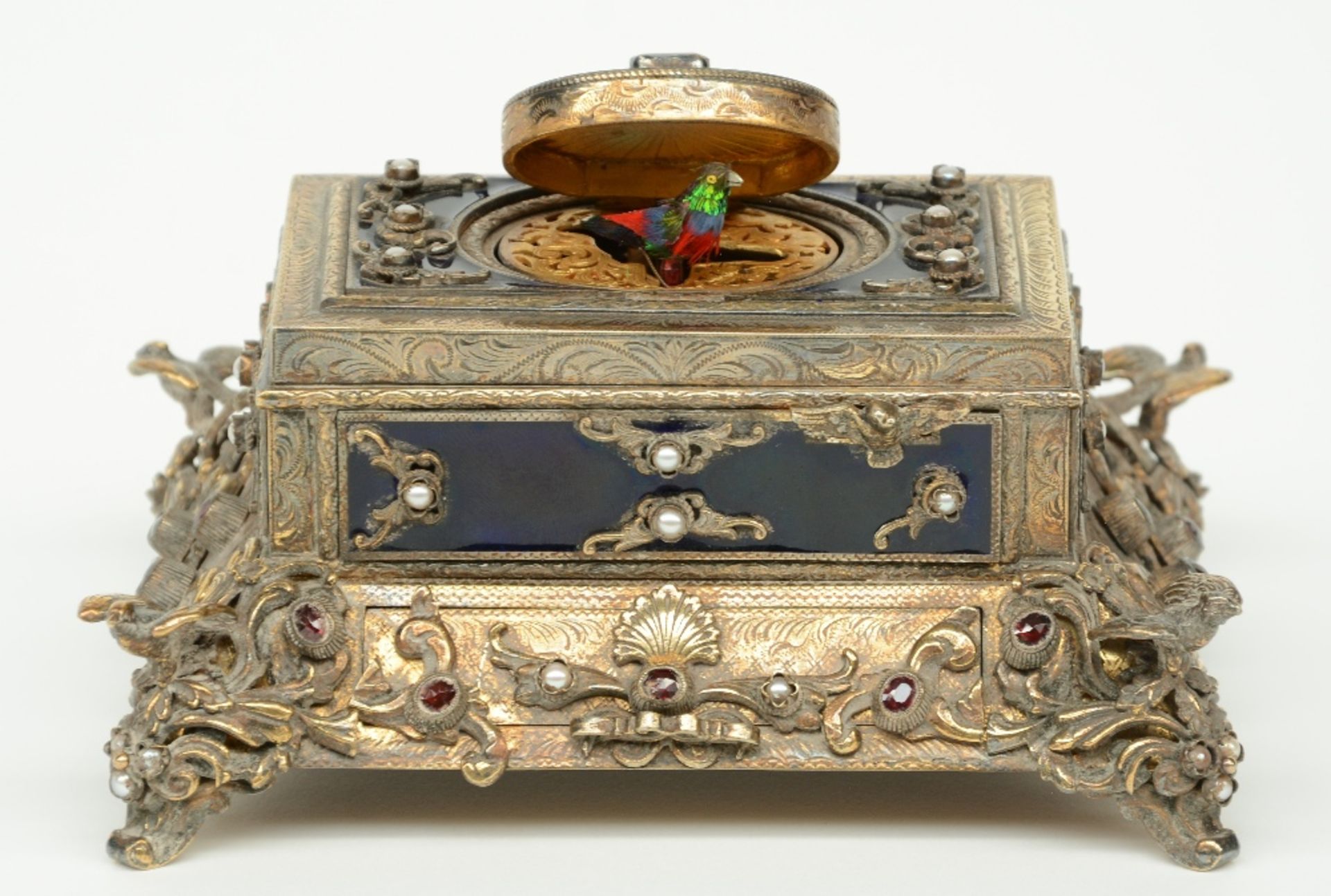 An exceptional gilt silver music box, partially cobalt blue enamelled, ruby set and inlaid with