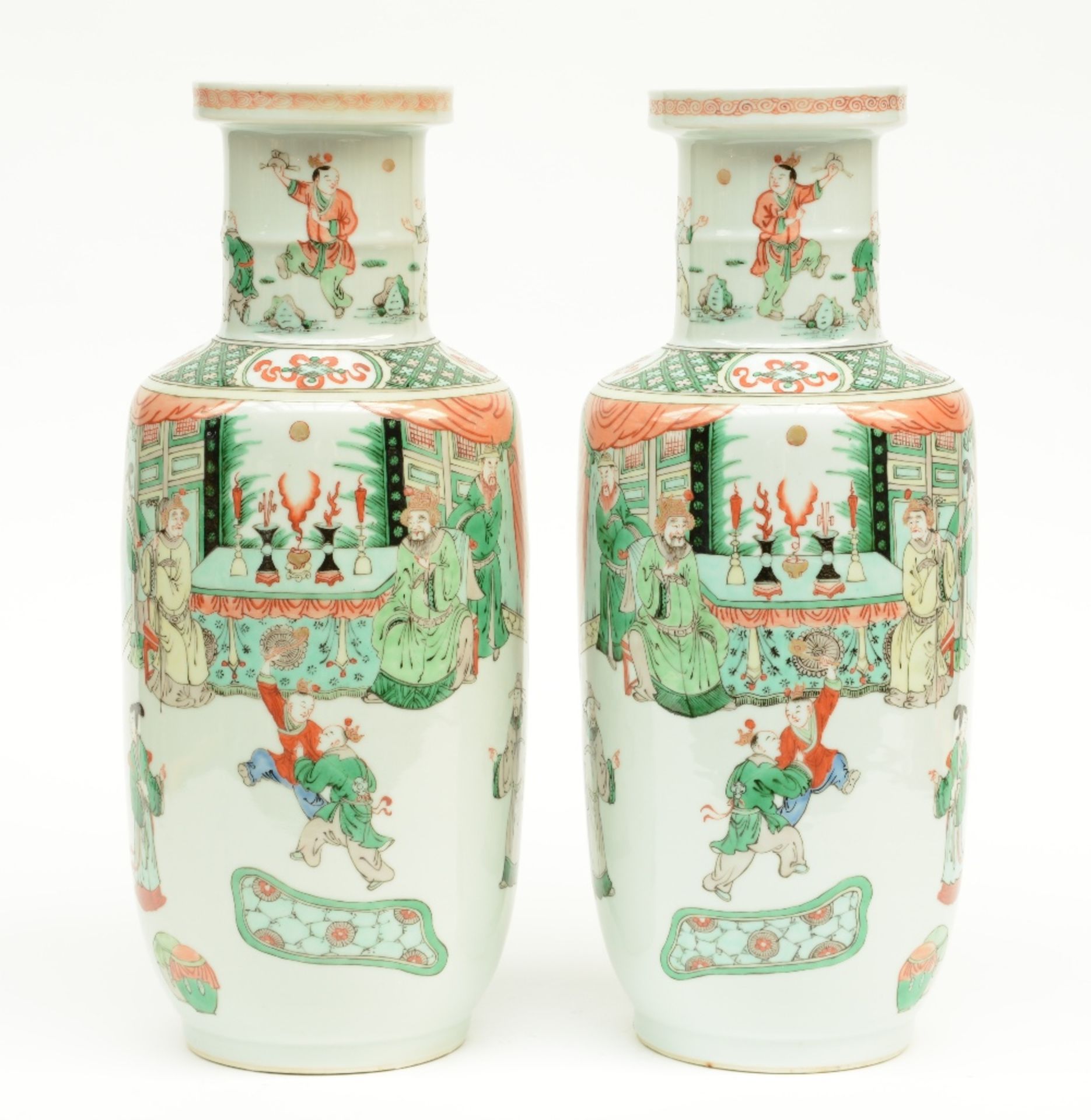 A fine pair of Chinese rouleau shaped vases, famille verte overall decorated with an animated scene,