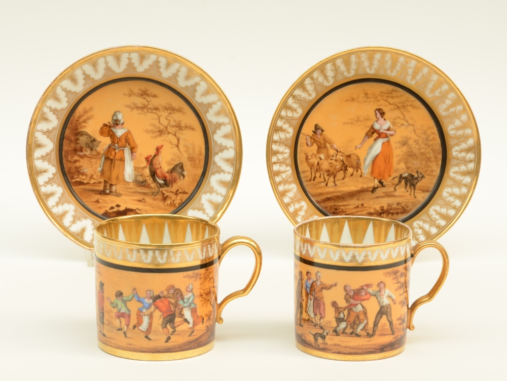 A rare pair of polychrome decorated Biedermeier period cups and saucers, about 1830, with a