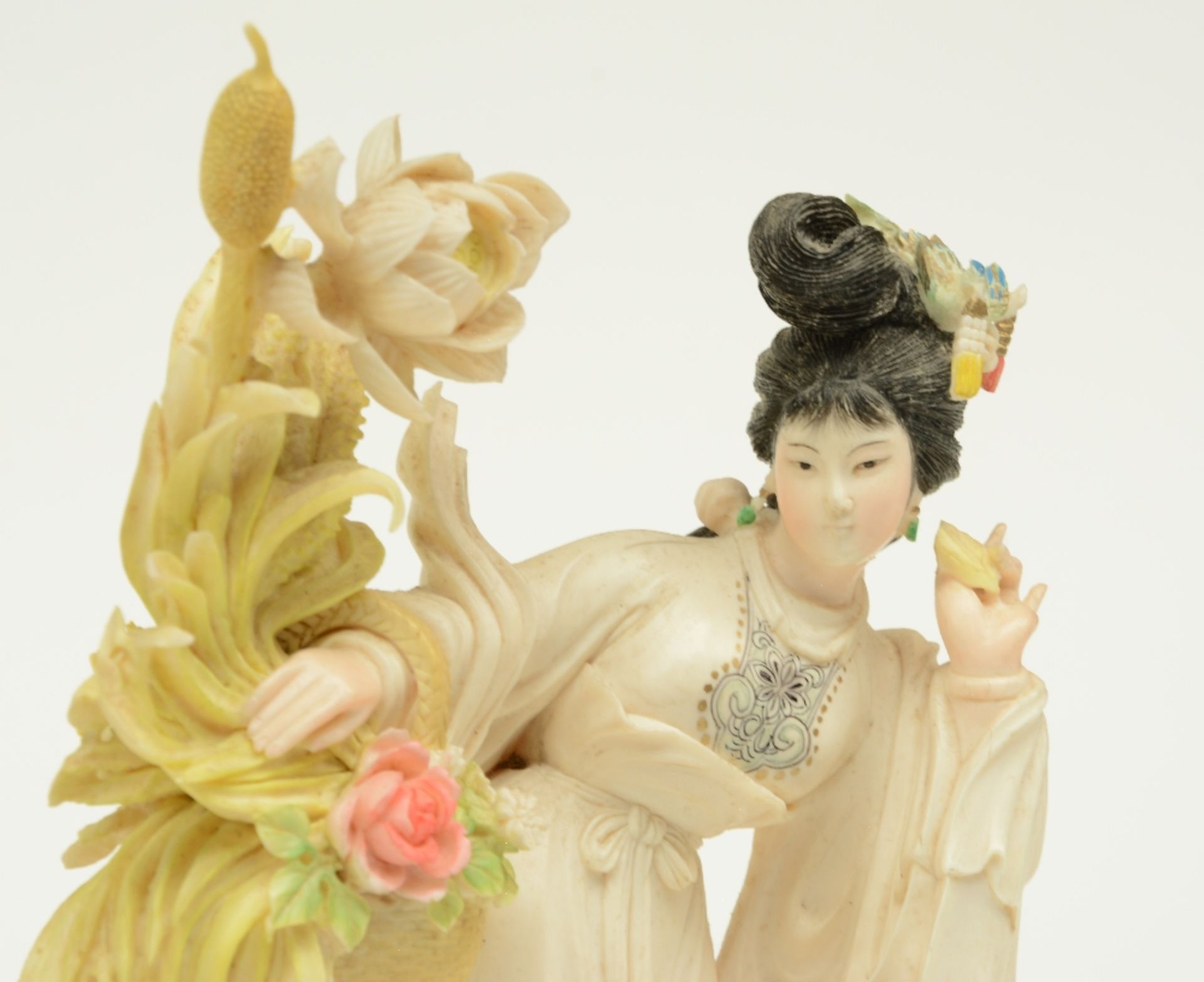 A Chinese ivory sculpture, polychrome decorated, depicting a court lady holding a flower basket, - Image 5 of 6