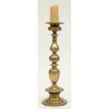 A 17thC Low Countries bronze candlestick, H 56,5 cm (restored)
