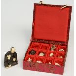 Ten scrimshaw decorated netsuke, ivory, mammoth ivory and wood, first half 20thC; added okimono in