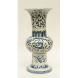 A Chinese Gu vase, blue and white decorated with dragons, floral motifs and birds, marked, H 56,5 cm