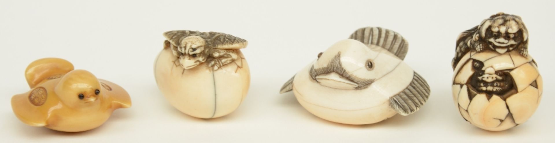 Four exceptional Edo period Japanese ivory katabori-netsuke, two in the form of little chicken,