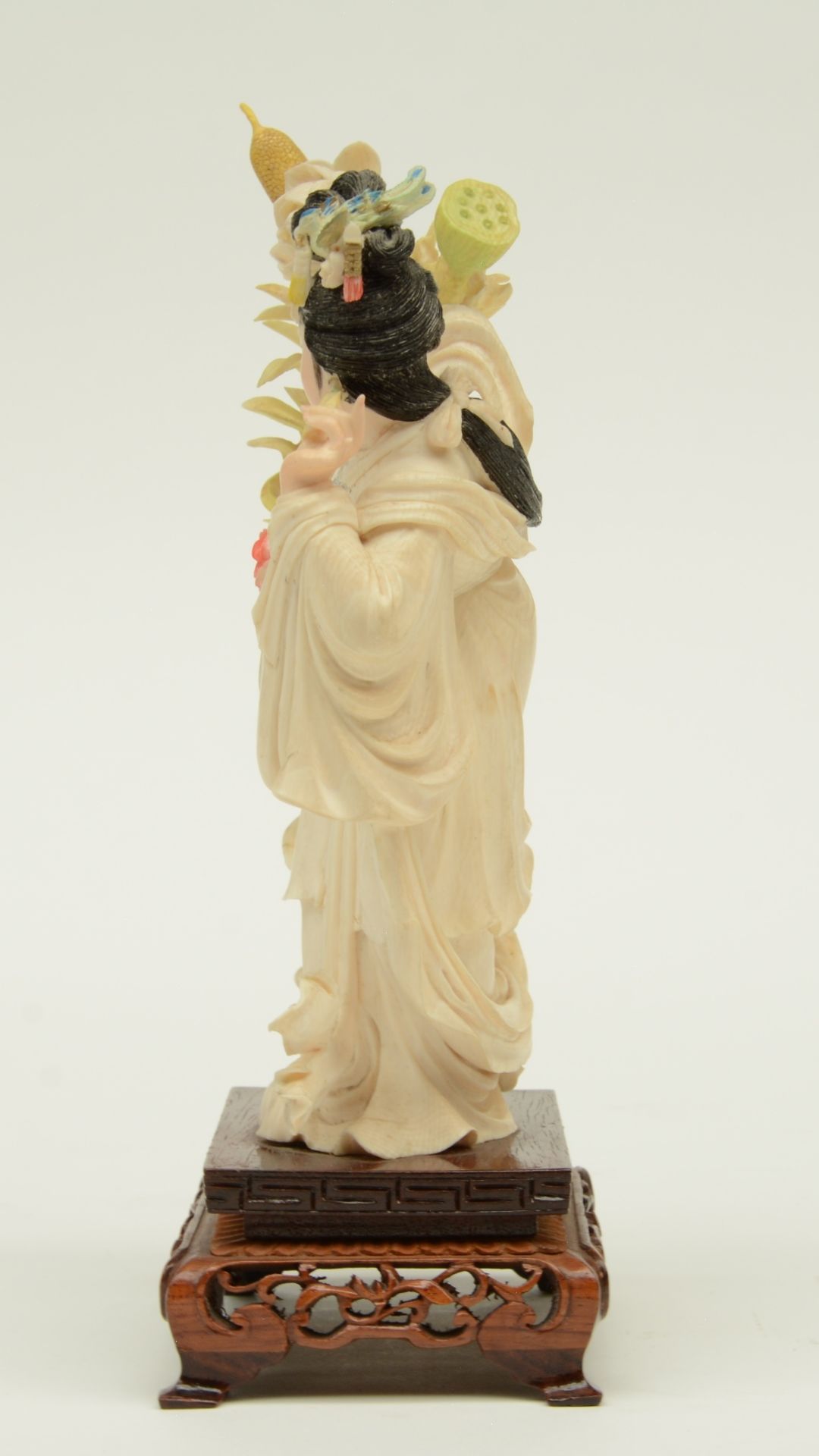 A Chinese ivory sculpture, polychrome decorated, depicting a court lady holding a flower basket, - Image 2 of 6