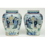 A pair of exceptionnel Chinese wucai vases, overall decorated with an animated scene, H 49 cm (one