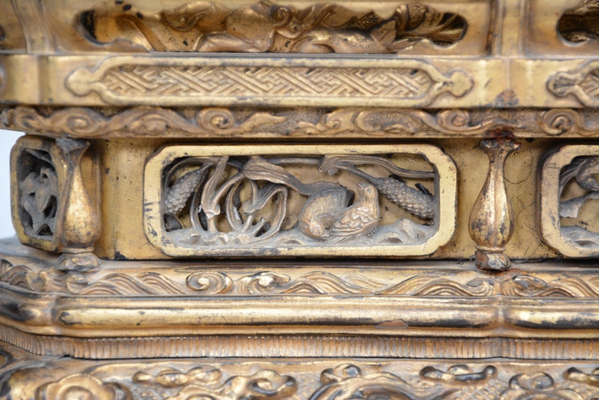 An 18thC Oriental gilt wooden temple with two sitting Buddha's on lotus seat and rich carvings, H 60 - Bild 8 aus 10