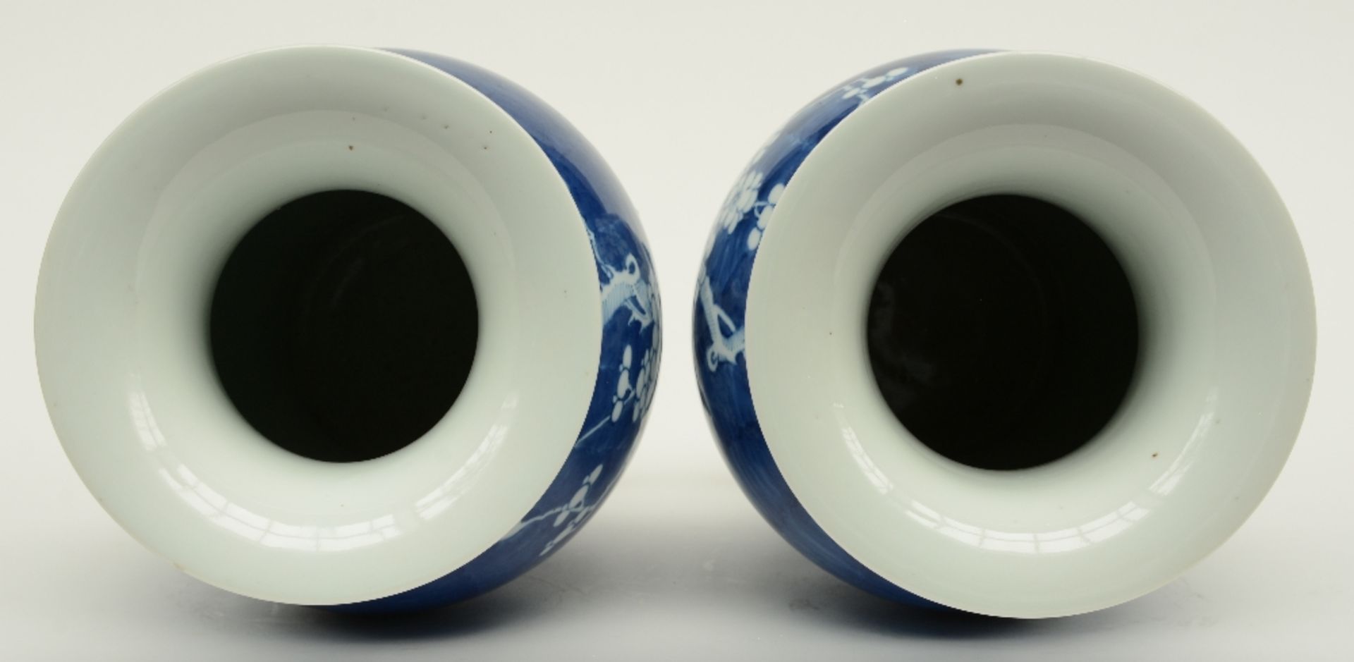 A pair of Chinese blue and white decorated vases painted with prunus blossoms, H 42,5 cm - Image 5 of 6