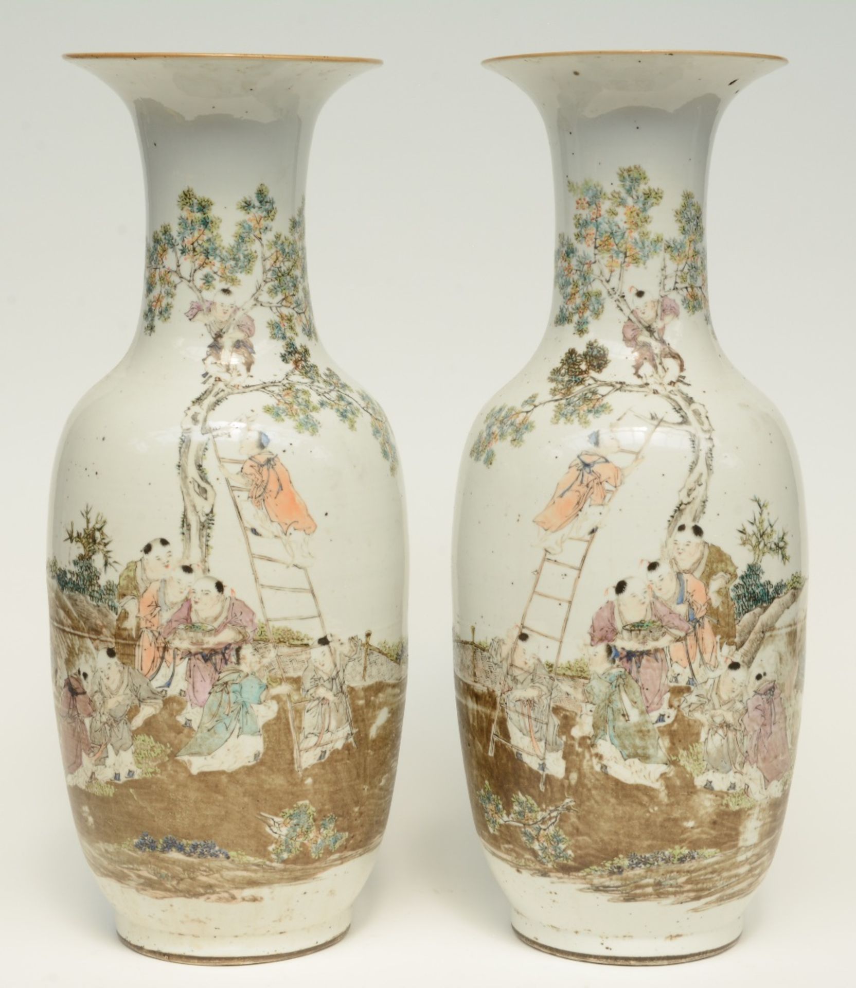 A pair of Chinese polychrome decorated vases, painted with an animated scene, signed and marked,