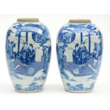 A pair of Chinese blue and white vases, decorated with an animated garden scene, 19thC, H 34 cm (