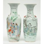 Two Chinese polychrome vases, decorated with figures in a garden, H 58 - 59 cm (one vase with firing