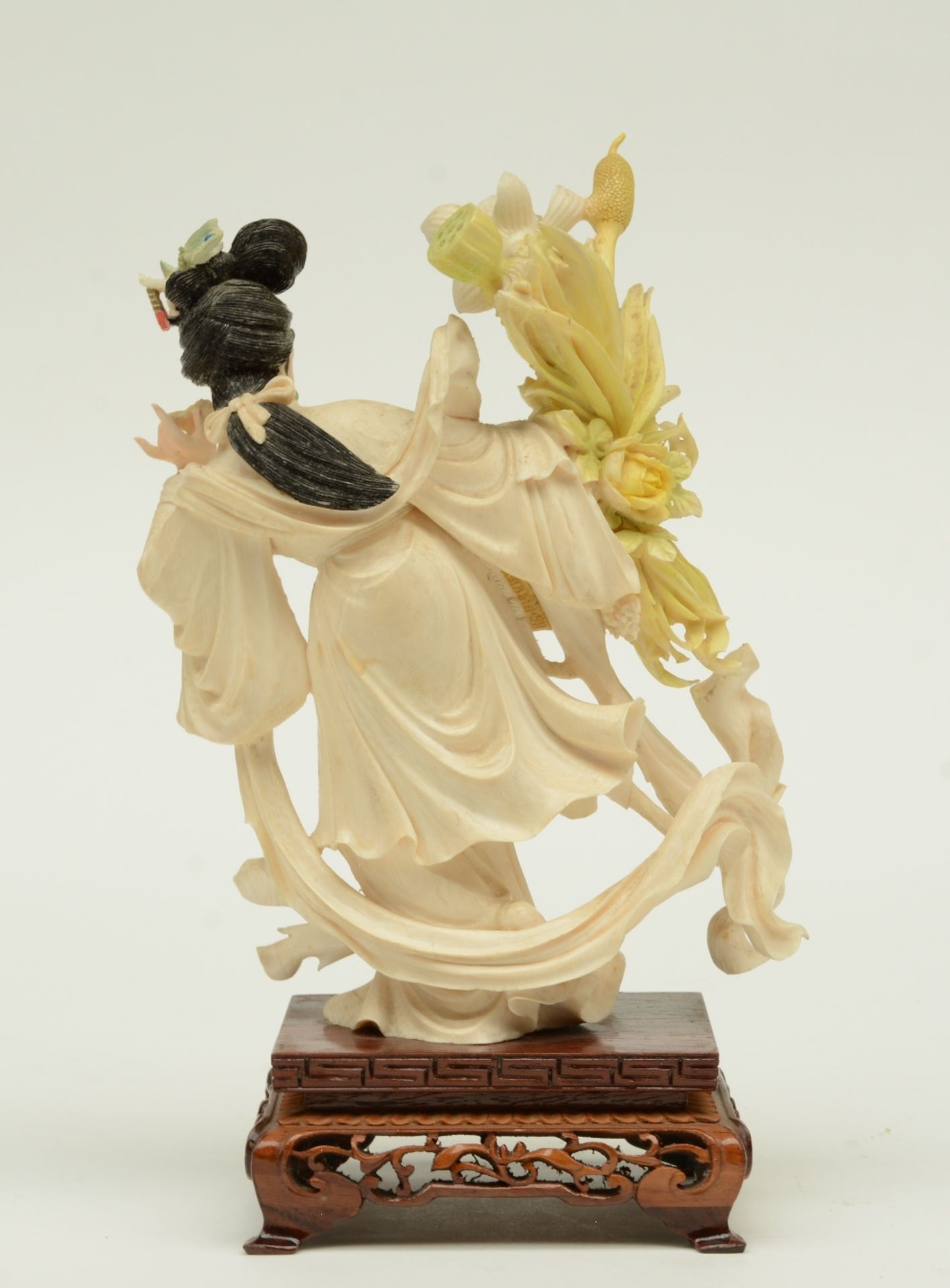 A Chinese ivory sculpture, polychrome decorated, depicting a court lady holding a flower basket, - Image 3 of 6