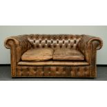 A Chesterfield sofa with brown leather upholstering,  H 77 - W 177 - D 96 cm