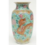 A Chinese turquoise ground famille rose vase, decorated with dragons, 19thC, H 37,5 cm