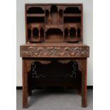 A Chinese carved hardwood travelling desk, relief decorated with dragons and symbols, H 83 - D