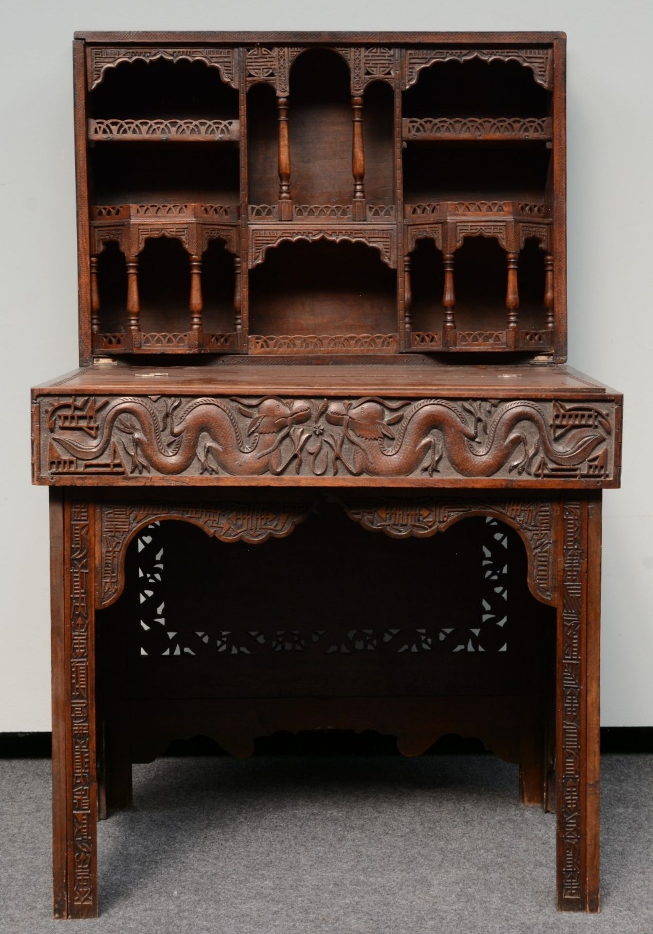 A Chinese carved hardwood travelling desk, relief decorated with dragons and symbols, H 83 - D
