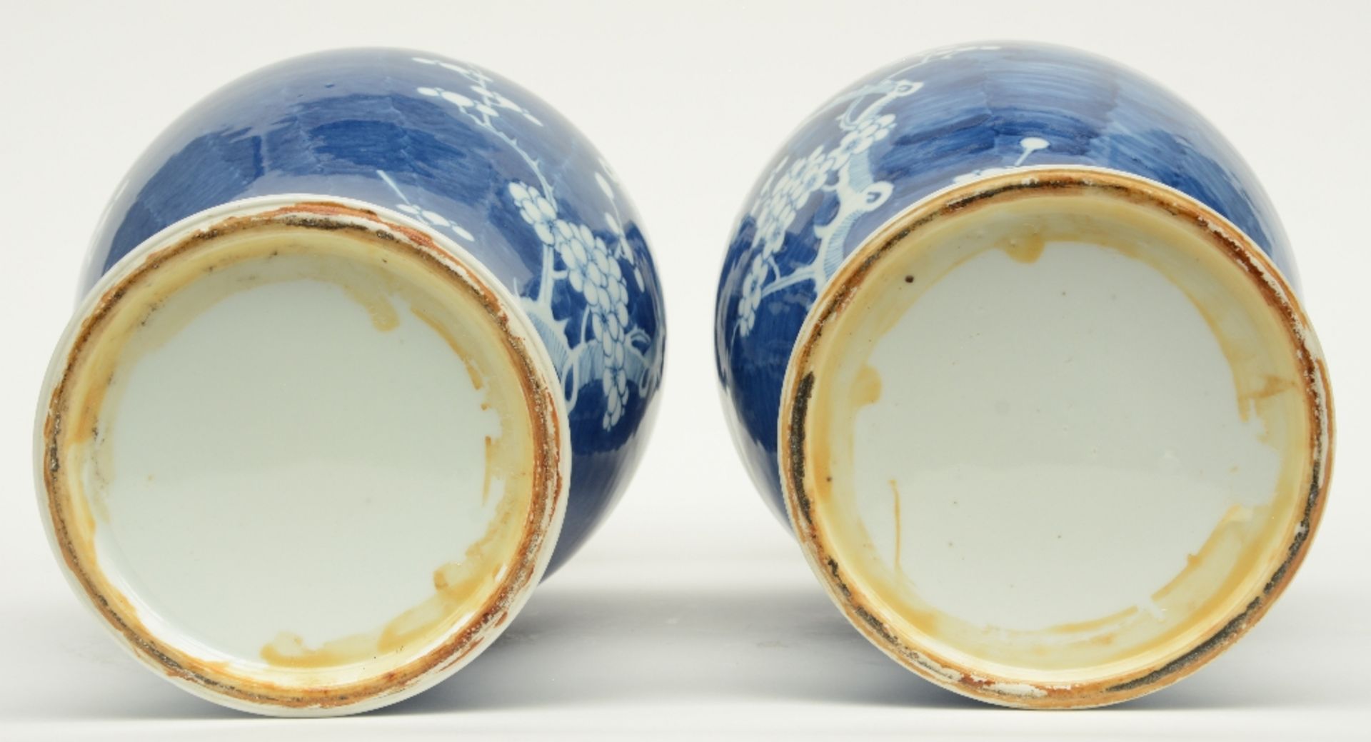 A pair of Chinese blue and white decorated vases painted with prunus blossoms, H 42,5 cm - Image 6 of 6