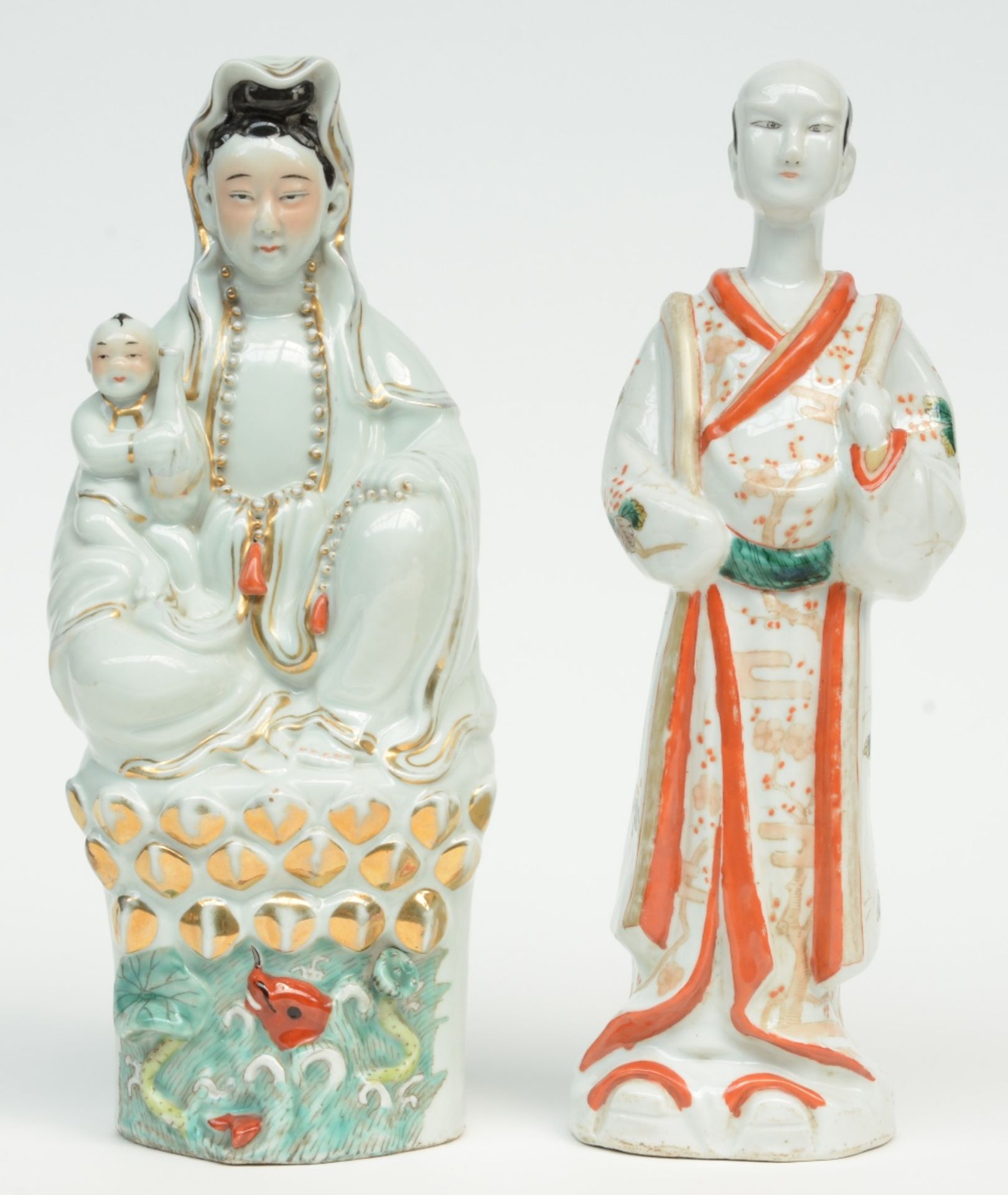 A Chinese polychrome decorated figure of a Guanyin with child sitting on a lotus, marked, 19thC, H