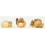 Three early Meiji period Japanese ivory katabori-netsuke, in the form of children playing with a