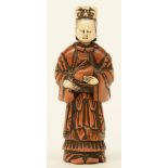 A Japanese early Meiji period  erotic boxwood and bone netsuke depicting a lady, out of two parts, H