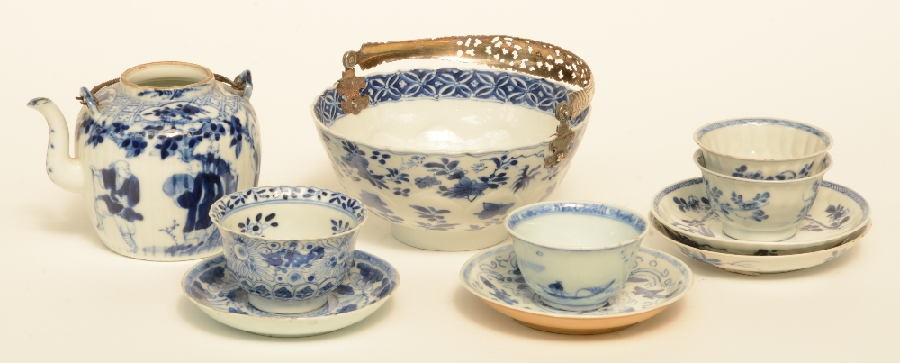 Four Chinese blue and white cups and saucers, and a dito tea pot, 18thC/19thC; added a ditto bowl,