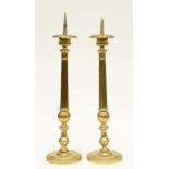 A pair of brass Neoclassical candlesticks, H 73,5 - 76,5 cm