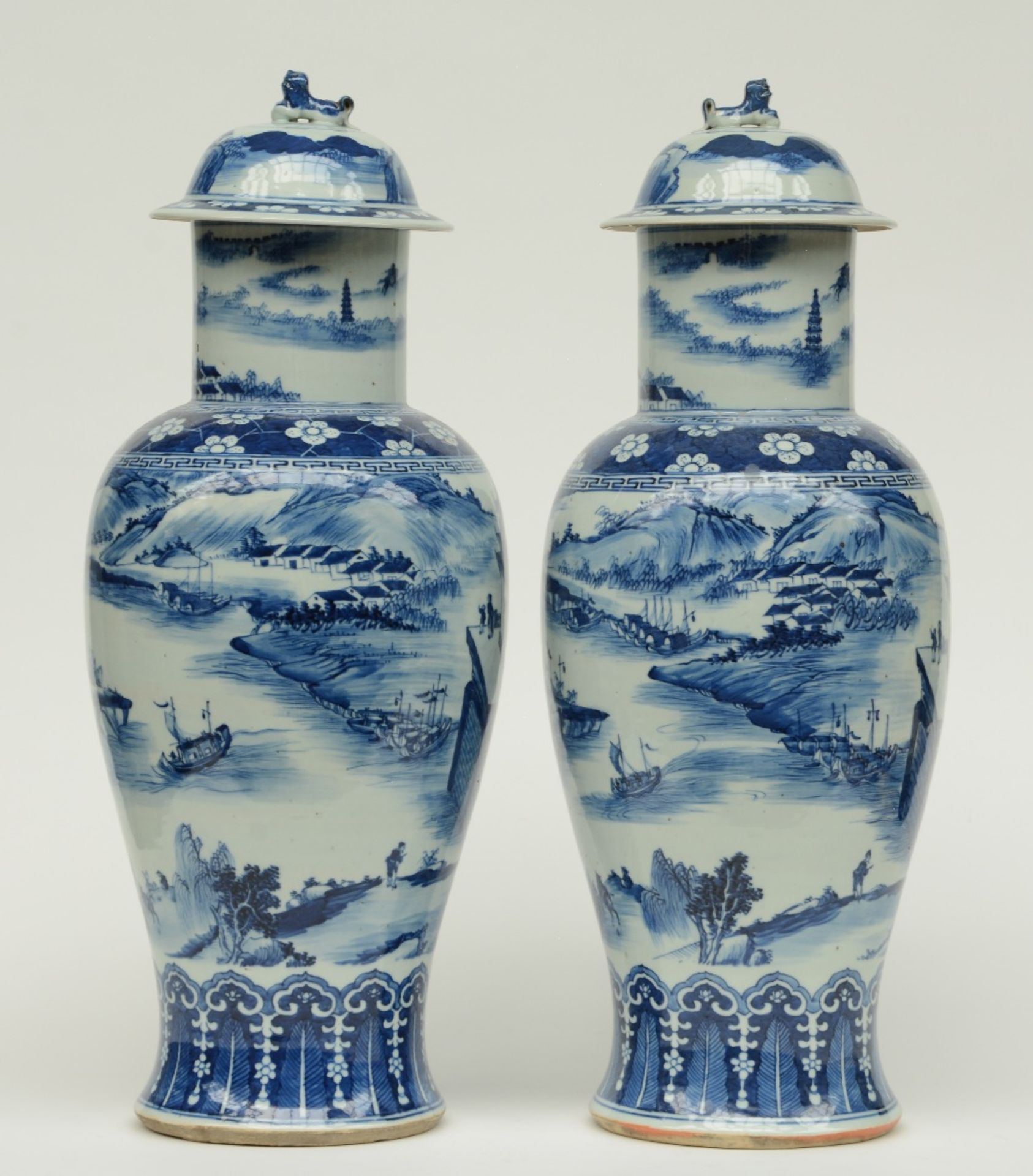 A pair of Chinese blue and white baluster shaped vases with cover, overall decorated with a river - Image 3 of 9