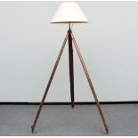 A decorative floor lamp with a 19thC tripod feet, H 183 cm