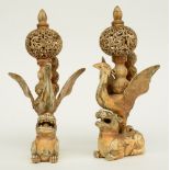 A pair of late 19thC - early 20thC ivory sculptures (out of various parts) depicting cranes