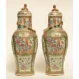 A pair of Chinese Canton vases with relief decoration in the shape of dragons, 19thC, H 67 - 68