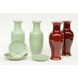 A pair of Chinese celadon vases and three ditto dishes, marked; added a pair of Chinese 'sang de