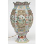 A Chinese hexagonal polychrome wedding lantern with openwork decoration on a matching base, the