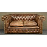 A Chesterfield sofa with brown leather upholstering,  H 77 - W 177 - D 96 cm