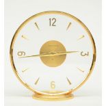 A circular gilt brass Jaeger - Lecoultre mantel clock, H 16,5 - Diameter 16,5 cm