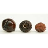 Two Japanese wooden karakuri netsuke, one in the form of a peach with inside two Go-playing man; the