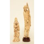 A Chinese ivory figure of a monk, on a wooden base, late Qing period, H 36 cm (whithout base); added