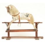 A 19thC polychrome painted wooden rocking horse, H 87 - W 106,5 - D 35 cm