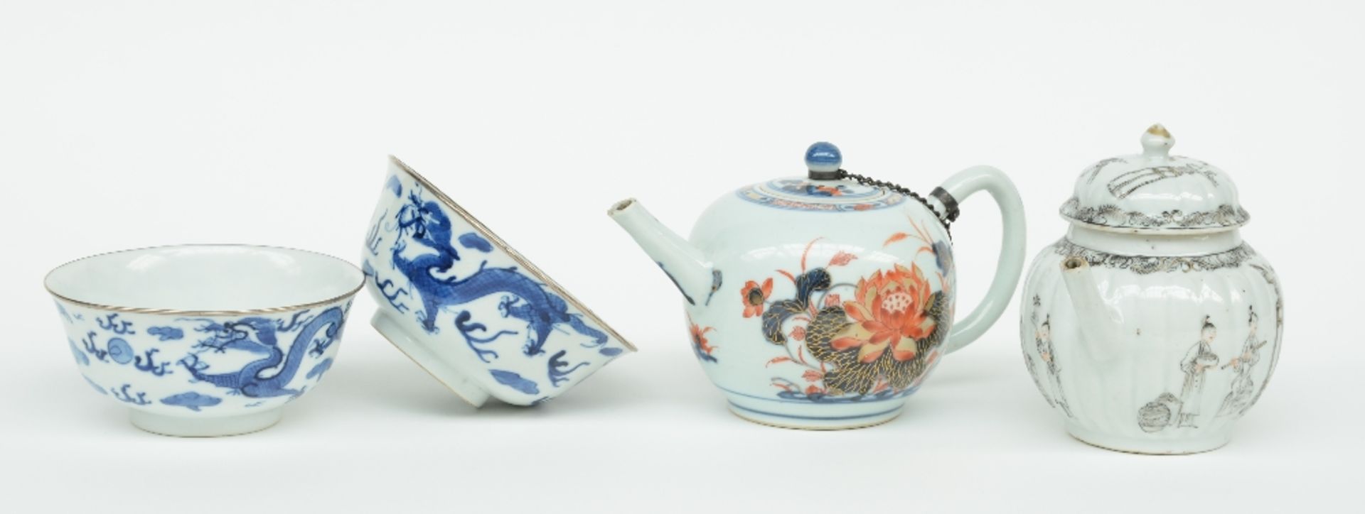 Two Chinese teapots with imari and India ink decoration, 18thC (chips); added two Chinese blue and